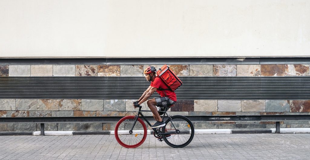 Delivery Man Riding Bike